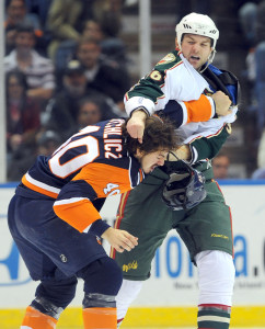 John Scott brawls with an opposing player in 2009, when Scott was a member of the NHL’s Minnesota Wild. On his captaincy this year, Scott said: “I’m not the normal All-Star.”