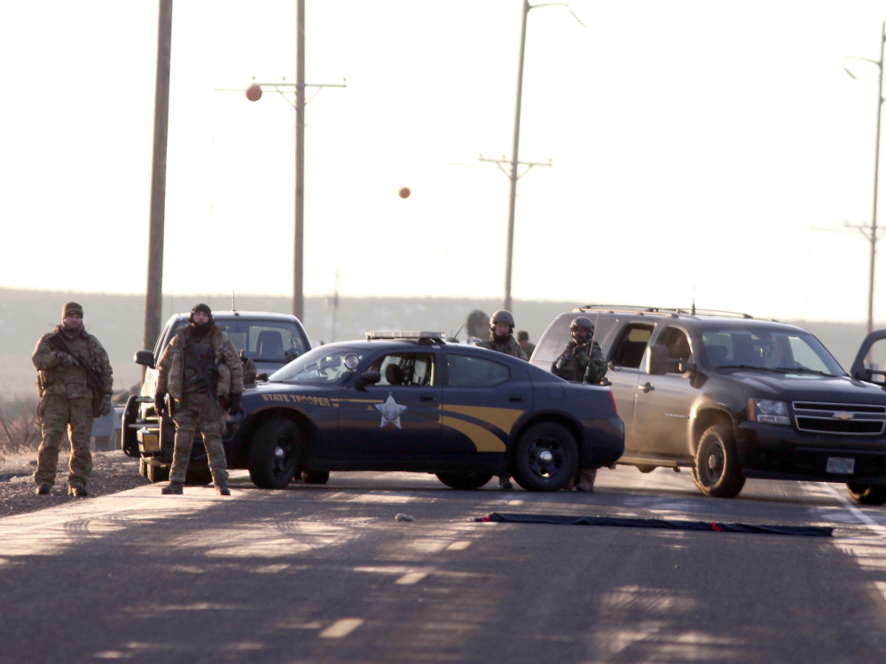 Beth Nakamura/The Oregonian via AP
Above: Authorities restrict access Wednesday to the Oregon refuge being occupied by an armed group after one of the occupiers was killed during a traffic stop and eight more, including the group’s leader, were arrested.
