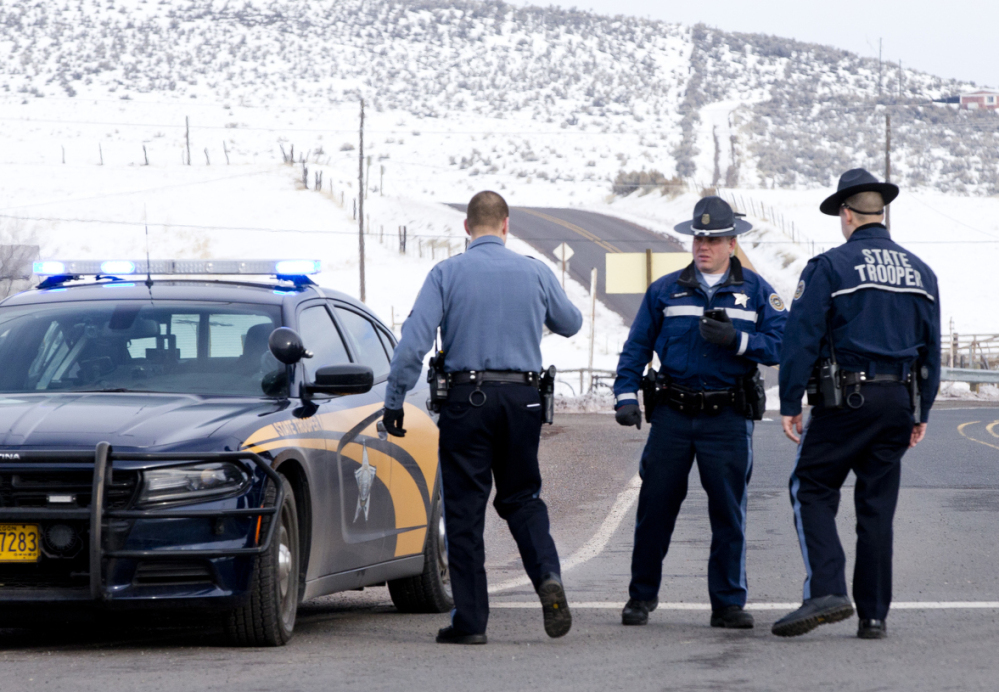 Police man a roadblock near Burns, Ore., on Wednesday. Authorities restricted access to the Malheur National Wildlife Refuge headquarters after an occupier was shot and killed.