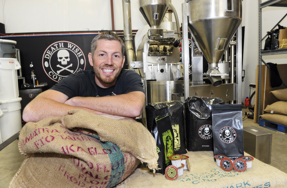 Michael Brown, owner of Death Wish Coffee Company, poses for a picture during Intuit QuickBooks Small Business Big Game finalists tour, in Round Lake, N.Y. Death Wish Coffee Co. won a competition held by software maker Intuit for a 30-second spot during the third quarter of the Super Bowl.