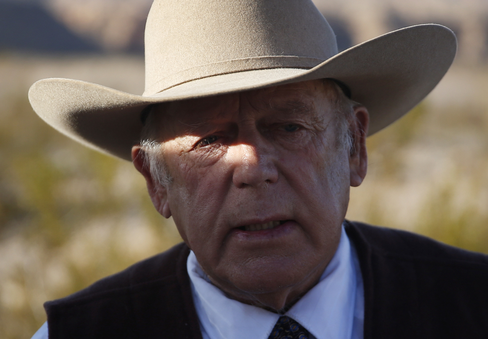 Rancher Cliven Bundy, the father of Ammon and Ryan Bundy, speaks to media near his ranch Wednesday in Bunkerville, Nev. Cliven Bundy and his wife, Carol Bundy, were returning from a trip to visit the family of LaVoy Finicum, a 55-year-old rancher from Cain Beds, Ariz., who died Tuesday after being shot by law enforcement officers.