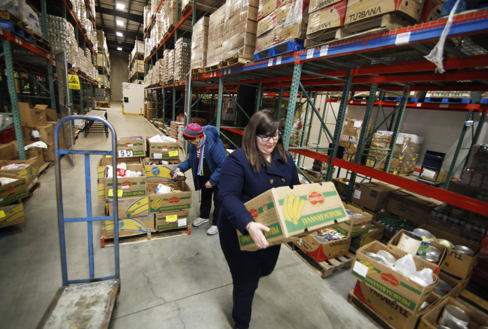 Hunger was nearly eliminated in the U.S. by the 1970s, but it’s now so widespread that charitable organizations like the Good Shepherd Food Bank in Auburn, above, have had to develop distribution systems that are as intricate as a grocery chain’s.