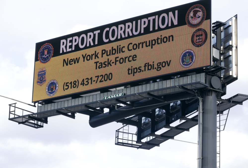A billboard shouts out to commuters on Interstate 90 in Albany, New York’s corruption-plagued capital. A tip line number and FBI website are listed.