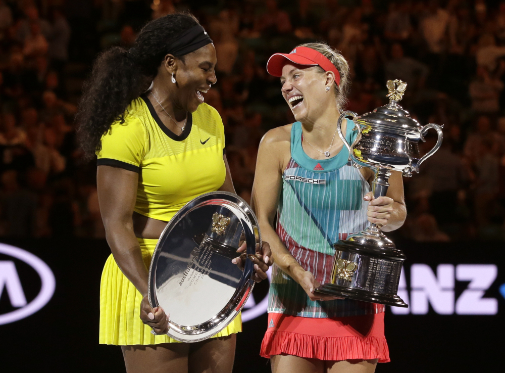 Angelique Kerber, right, laughs with runner-up Serena Williams after winning the women’s singles final at the Australian Open on Saturday.