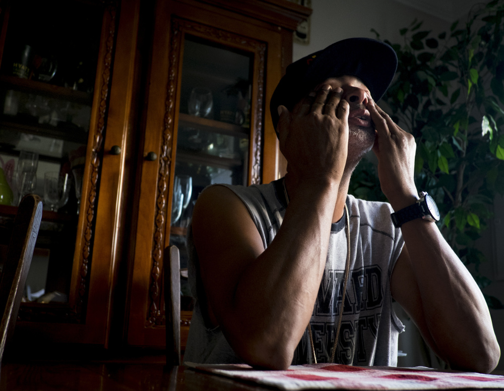Kevin Bushrod Sr. sits at his table in Manassas, Va., and bemoans the ordeal his son, Kevin Jr., endured during six months of  solitary confinement that included a suicide attempt and burgeoning mental disorders.