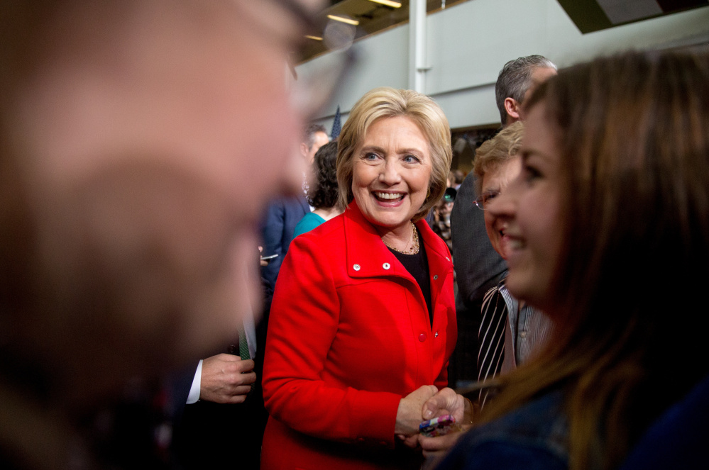 Democratic presidential candidate Hillary Clinton greets members of the audience after speaking at a rally at Iowa State University in Ames on Saturday. Her use of a personal email server during her time as secretary of state continues to haunt her campaign.