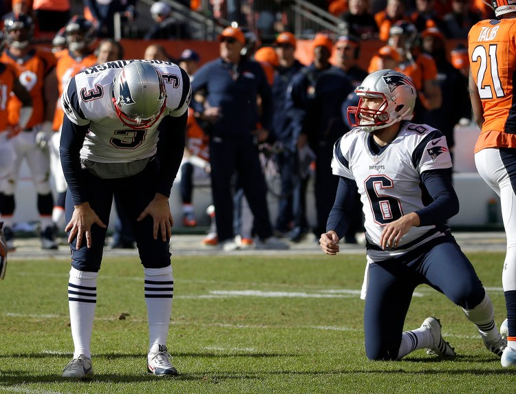 New England Patriots punter Ryan Allen (6) looks on as Patriots kicker Stephen Gostkowski reacts after missing an extra point following a touchdown by Steven Jackson during the first half. The Associated Press