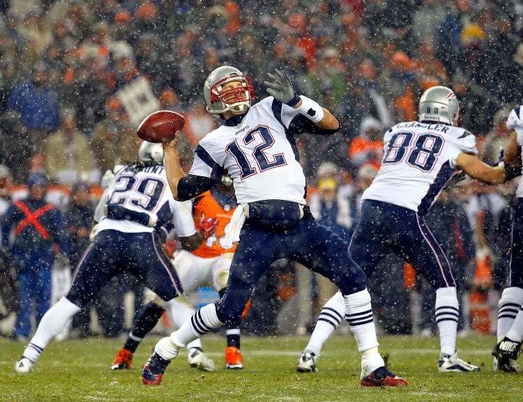 FILE - In this Nov. 29, 2015, file photo, New England Patriots quarterback Tom Brady (12) throws against the Denver Broncos during the first half of an NFL football game, in Denver. New England and Denver. The Associated Press