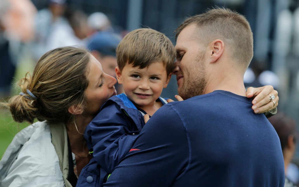 New England Patriots quarterback Tom Brady and his wife, Gisele Bundchen, with their son, Benjamin Brady ,after a joint workout with the Tampa Bay Buccaneers in 2013. Brady and the rest of his teammates find room for family as they prepare for playoff games.
The Associated Press