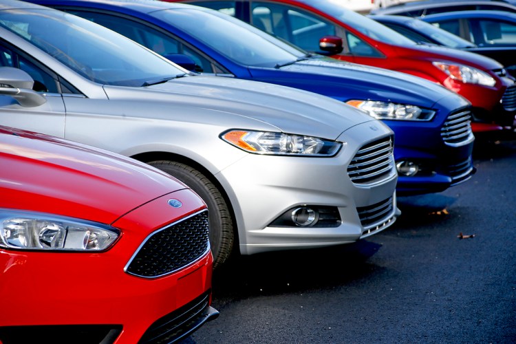 New 2015 Ford Fusions await buyers on the sales lot at a Butler, Pa. , dealership. Ford was the best-selling brand for the sixth straight year, with sales of just over 2.5 million vehicles. The Associated Press