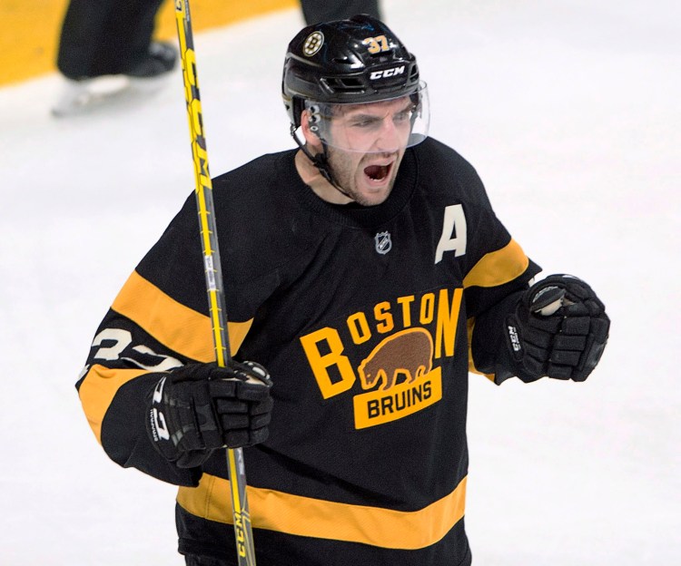 Boston center Patrice Bergeron celebrates after scoring against the Montreal Canadiens on Tuesday during the Bruins' 4-1 win.