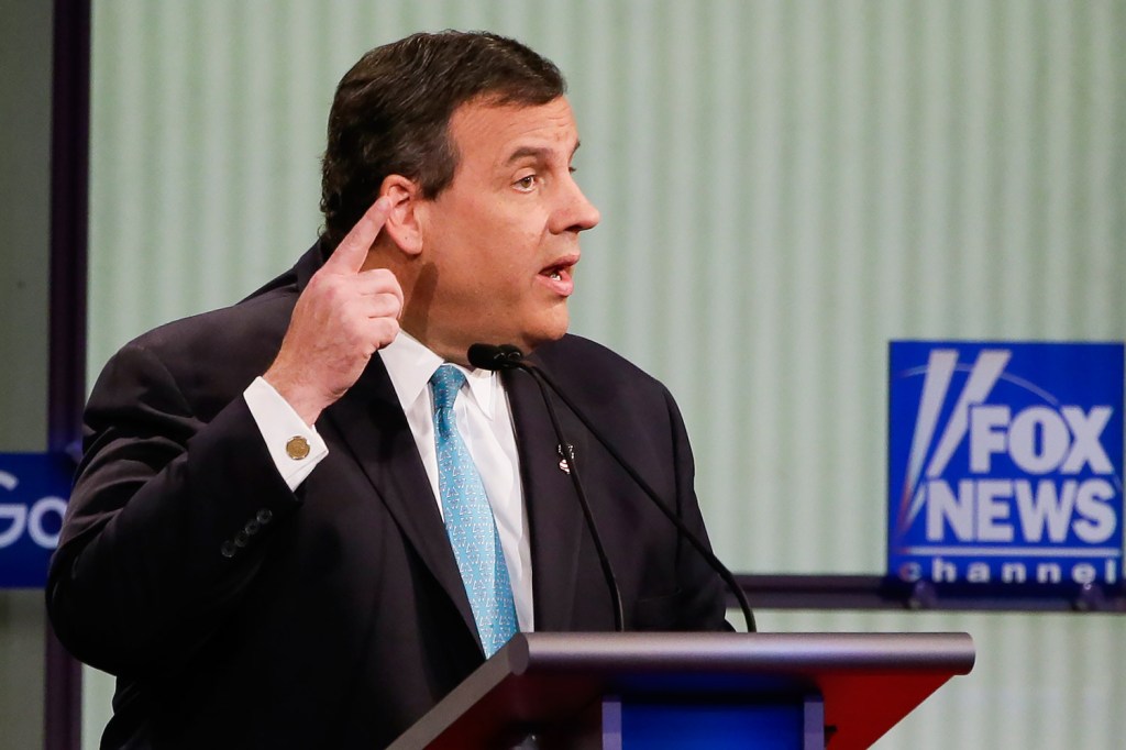 Chris Christie  answers a question during the debate. He attacked Democratic front-runner Hillary Clinton, saying, "She is not qualified to be president."
The Associated Press