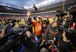 Denver Broncos quarterback Peyton Manning waves to the crowd after defeating the New England Patriots in the AFC Championship football game at Sports Authority Field. Kevin Jairaj/USA TODAY Sports 