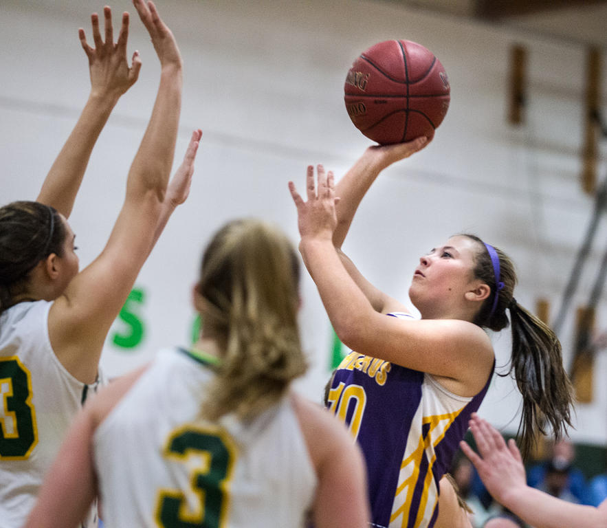 Cheverus junior Ally Tillotson shoots over McAuley senior Jess Willerson. Michael Strout
