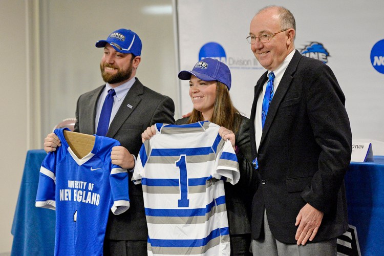 UNE Athletic Director Jack McDonald, right, introduces then-new football coach Mike Lichten and new women's rugby coach Ashley Potvin at the University of New England on Feb. 4, 2016.