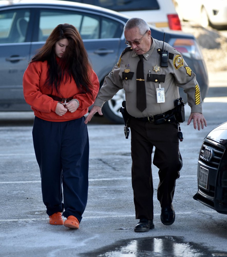 Kayla Stewart is escorted into Somerset County Superior Court in Skowhegan on Friday.