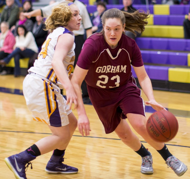 Emily Esposito, who finished with 36 points and six steals, attempts to dribble past Deirdre Sanborn of Cheverus during Gorham’s 64-36 victory Tuesday night.