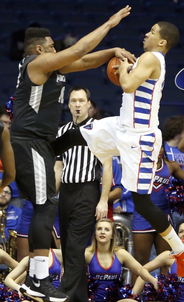 Quadree Smith, left, of Providence strips the ball from DePaul’s Billy Garrett Jr. during a 77-70 DePaul win Tuesday at Rosemont, Ill.