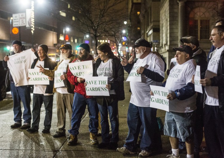 Supporters of Forest Gardens make their feelings known outside Portland City Hall on Wednesday evening as the Historic Preservation Board considers protecting the building that houses the bar.
