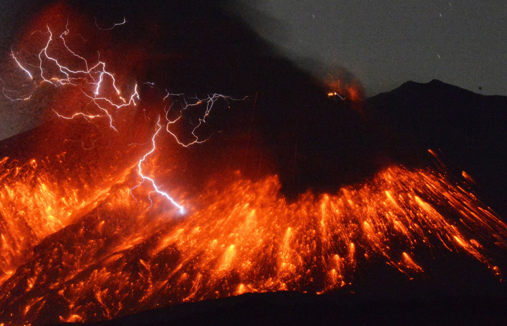 Lightning flashes above flowing lava as Sakurajima, a well-known volcano, erupts Friday evening in southern Japan. Nobody is allowed with a 1.2-mile radius around the crater as rocks and lava spew out of the mountain.