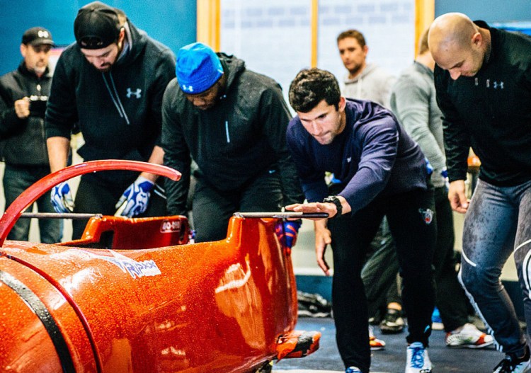 Frank Del Duca, second from right, trains with the U.S. bobsled team in Park City, Utah.