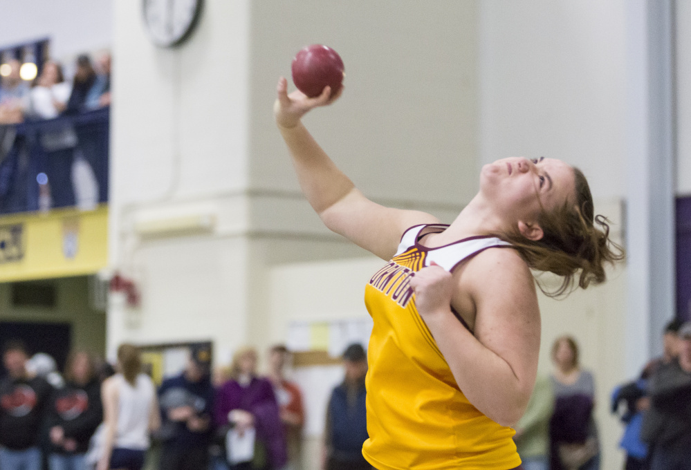 Samantha Curran of Thornton Academy unleashes a throw on her way to victory in the shot put. Curran won the event by more than five feet, with a heave of 38-11 .