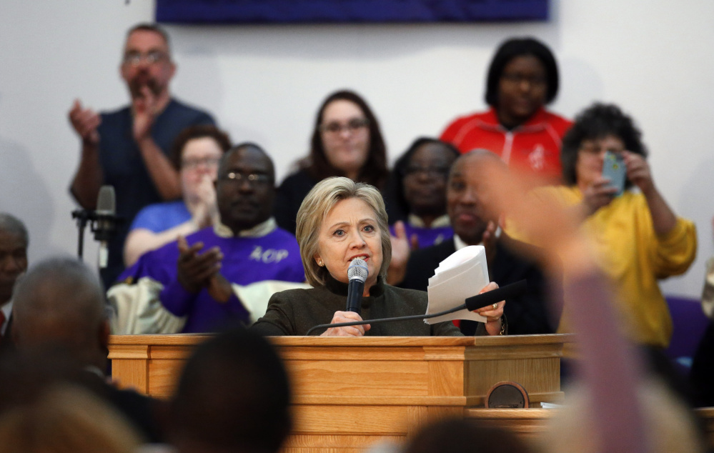 Democratic presidential candidate Hillary Clinton speaks at the House of Prayer Missionary Baptist Church on Sunday in Flint, Mich.