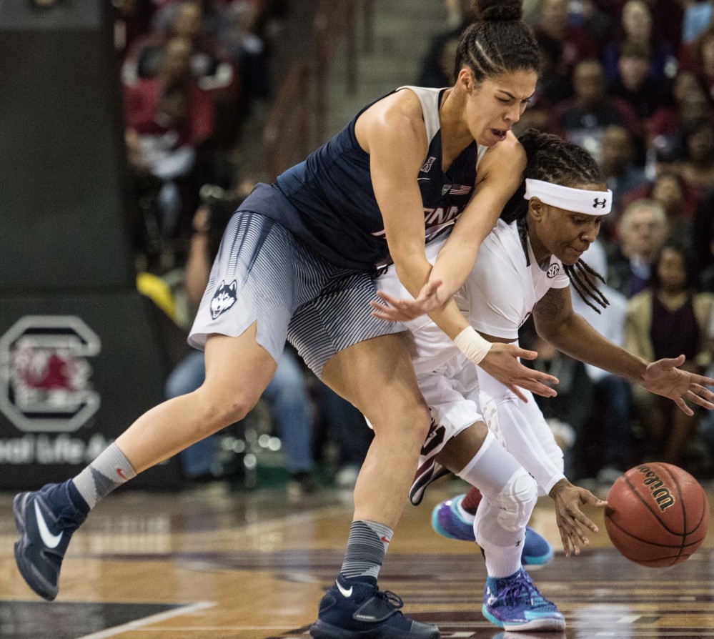 South Carolina’s Khadijah Sessions, right, battles Connecticut’s Kia Nurse for a loose ball during the first half of the Huskies’ 66-54 win Monday at Columbia, South Carolina.