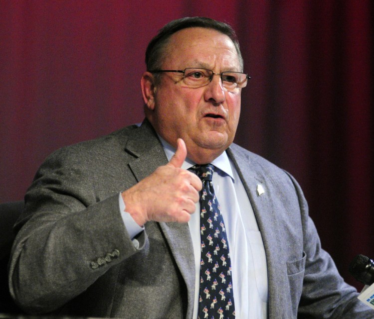 Gov. Paul LePage speaks at a town hall in Farmingdale on Tuesday, the day he told a radio station that he made “outrageous comments” to get the attention of legislators.