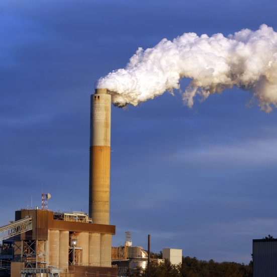 A plume of steam billows from the coal-fired Merrimack Station in Bow, N.H. Capturing significant amounts of carbon from power plants has been an elusive goal for the fossil-fuel industry..