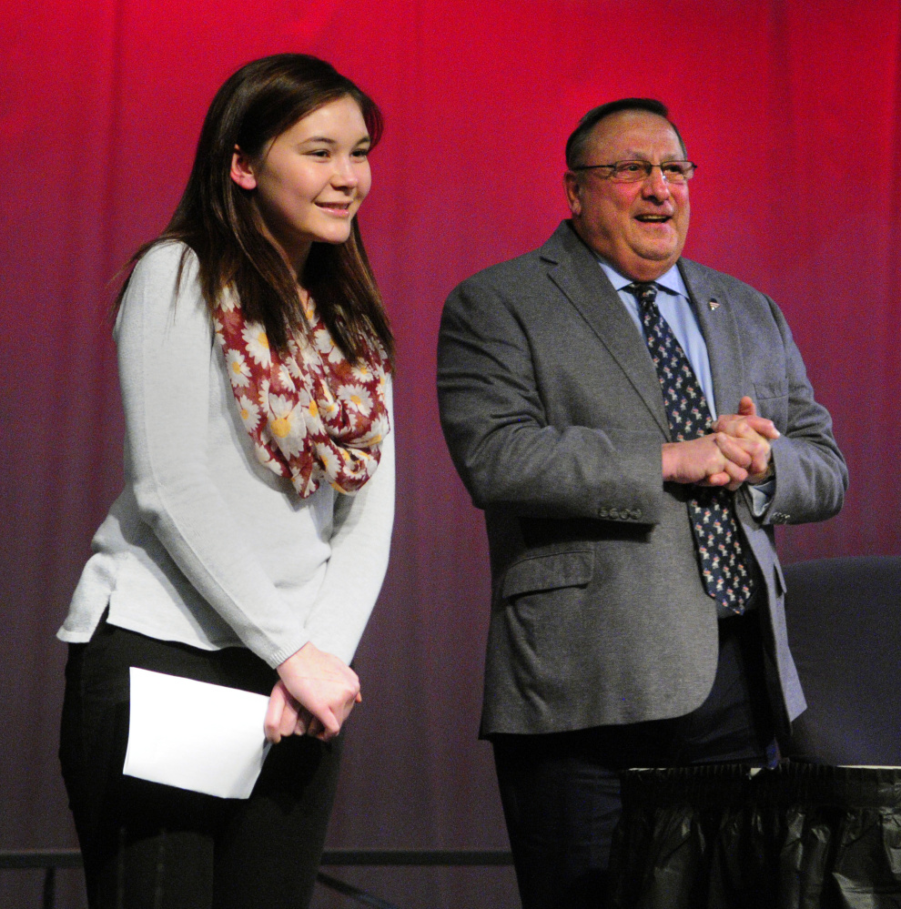 Cassie DiBenedetti, left, introduces Gov. Paul LePage before his town hall-style meeting Tuesday at Hall-Dale High School in Farmingdale.