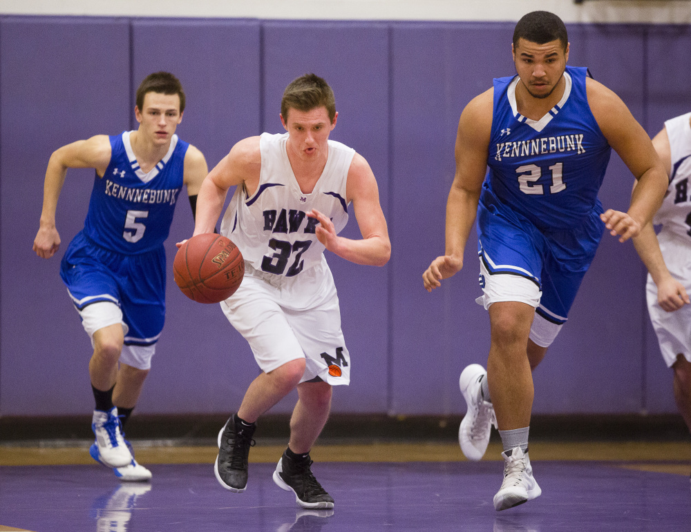 Ben Beers of Marshwood finds room to dribble up the court between Justin Wiggins, left, and Travon Bradford of Kennebunk during Marshwood’s 63-54 victory in a Class A South prelim Tuesday night.