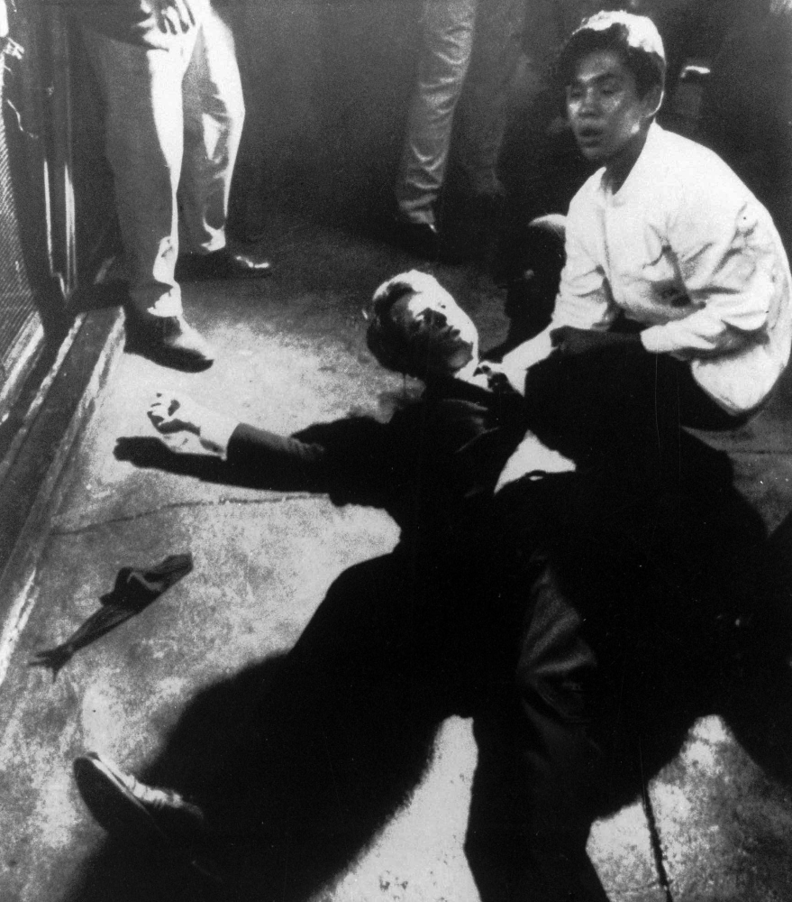 In this June 5, 1968, file photo, Sen. Robert F. Kennedy awaits medical assistance as he lies on the floor of the Ambassador hotel in Los Angeles moments after he was shot.