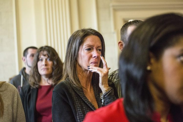Susan Johnson wipes a tear from her cheek as James Pak receives two life sentences in the 2012 murders of her son, Derrick Thompson, and his girlfriend, Alivia Welch, in Superior Court in Alfred on Feb. 11, 2016. Johnson, who was wounded in the attack, is suing the city of Biddeford, claiming police didn't do enough to prevent the shooting.
