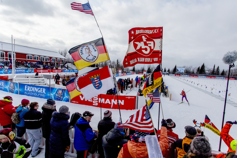 Vermont’s Susan Dunklee, right, skis past the grandstand Thursday at the Nordic Heritage Center in Presque Isle after shooting from the prone position on the first lap of the women’s 7.5-kilometer sprint at the World Cup Biathlon. The 29-year-old’s silver-medal-winning performance matched the best finish by a U.S. woman in biathlon history.