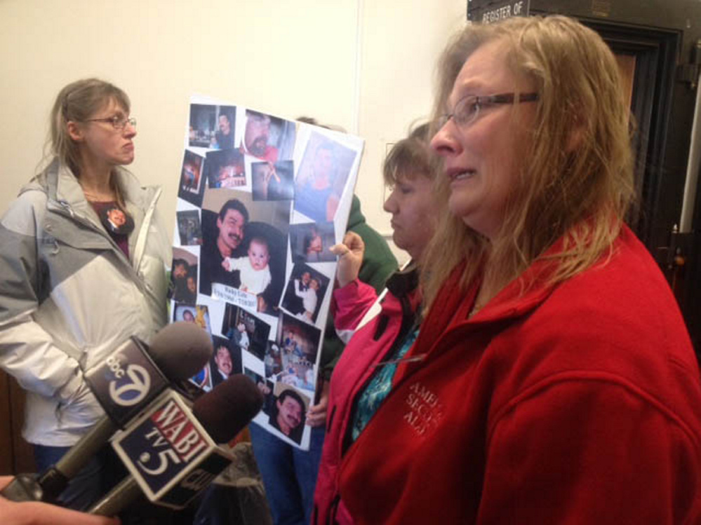 Sisters of murder victim Ricky Cole talk to reporters Friday outside the courtroom where Jason Cote was sentenced to 45 years in prison. The sisters are Annette Thibodeau, foreground, and Carmen Stanton, back.