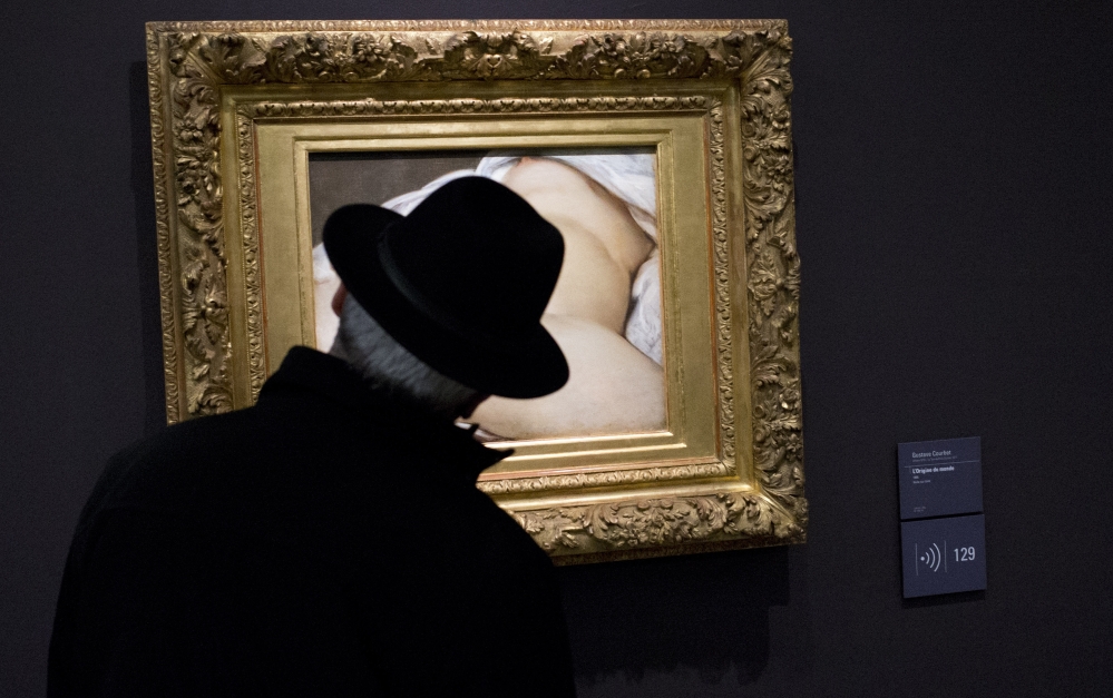 A Musée D’Orsay visitor in Paris looks at “The Origin of the World,” the painting involved in a suit against Facebook.