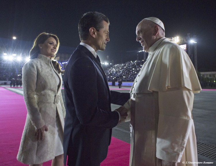 In this photo taken on Friday, Feb. 12, 2016, Pope Francis is welcomed by Mexico’s President Enrique Pena Nieto and first lady Angelica Rivera upon his arrival to the Benito Juarez International Airport in Mexico City.