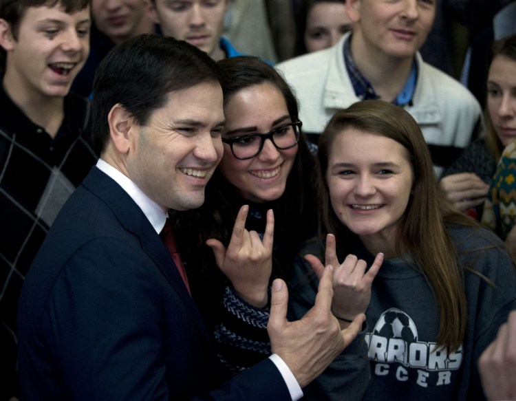 Republican presidential candidate Sen. Marco Rubio, R-Fla., poses for a photograph with supporters after speaking at a rally at Greenville Downtown Airport  Friday in Greenville, S.C.