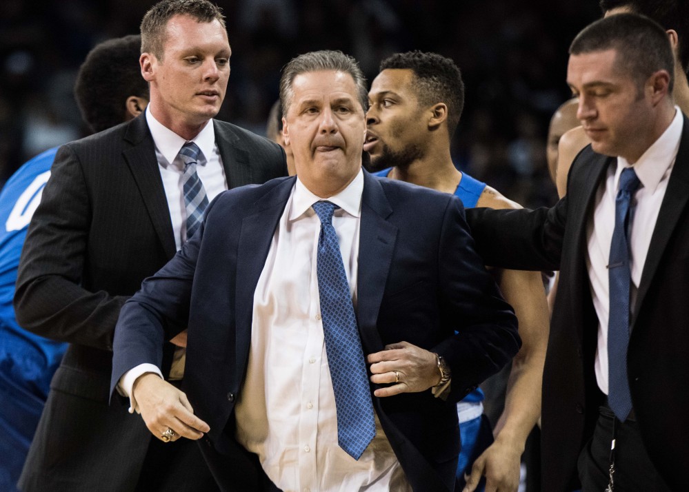 Kentucky Coach John Calipari leaves the court after receiving two technical fouls and being ejected during the first half of a game Saturday against South Carolina in Columbia, S.C. Despite Calipari’s ejection, the Wildcats went on to win easily, 89-62.