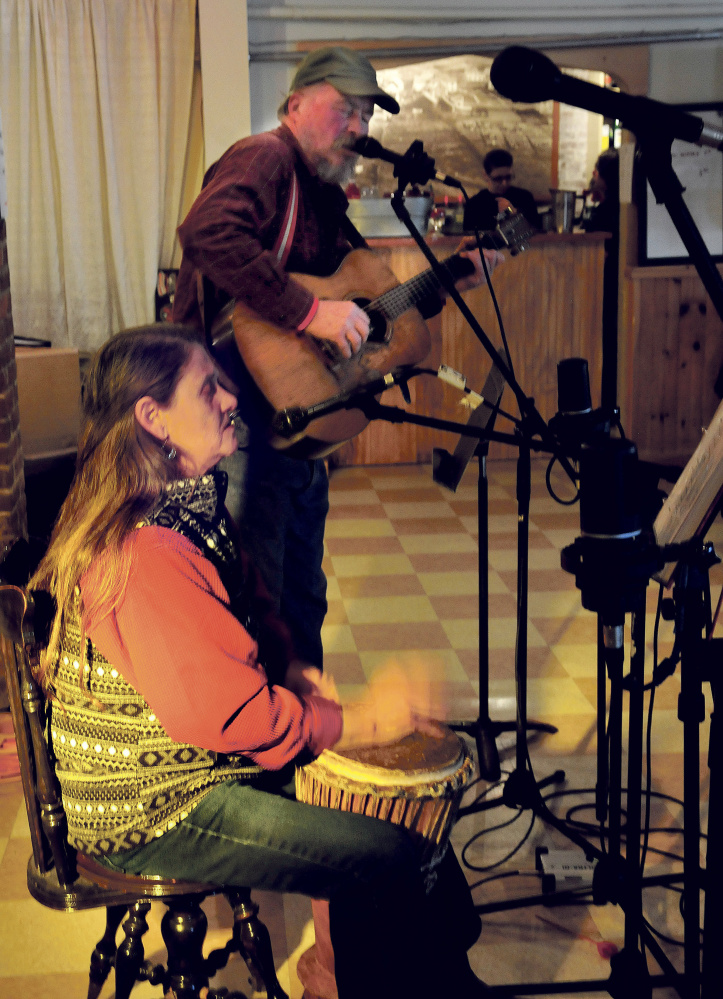 Ellie Howell and John Newsom perform on Sunday during an open mic fundraiser for nonprofit radio station WXNZ 98.1 at the Somerset Abbey in Madison.