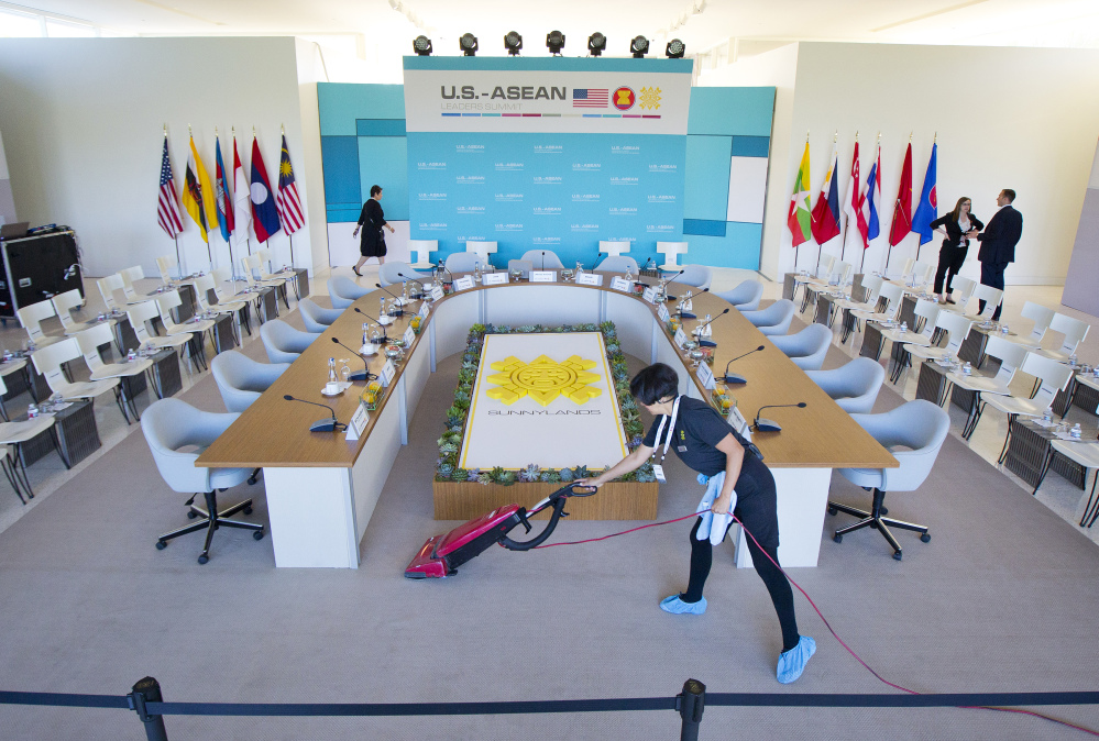 Maria Mendoza cleans and vacuums around the head table as last minute preparation are made at the Annenberg Retreat at Sunnylands in Rancho Mirage, Calif., site of today’s meeting of ASEAN, the 10-nation Association of Southeast Asian Nations,  Monday, Feb. 15, 2016. President Barack Obama is hosting the ASEAN leaders, it is the first meeting of its kind on U.S. soil, as he looks to deepen ties with the region’s fast-growing economies.