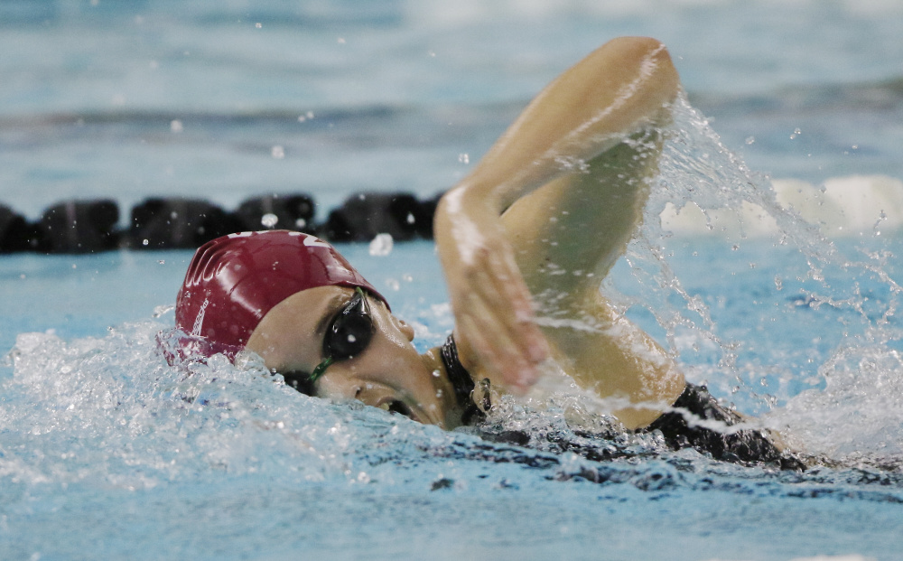 Olivia Tighe, a freshman from Cape Elizabeth, swims the 200-yard freestyle Monday during the state finals in Brunswick. Tighe won the race with a time of 1:55.48.