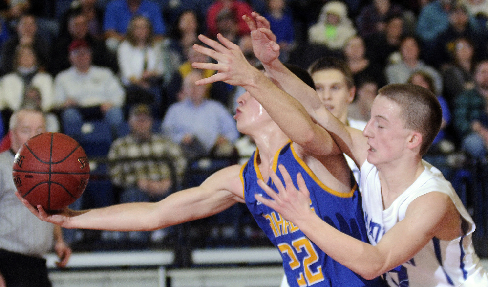 Madison sophomore guard Evan Bess, right, tries to stop Boothbay’s Jacob Leonard during a Class C South quarterfinal Monday afternoon at the Augusta Civic Center.