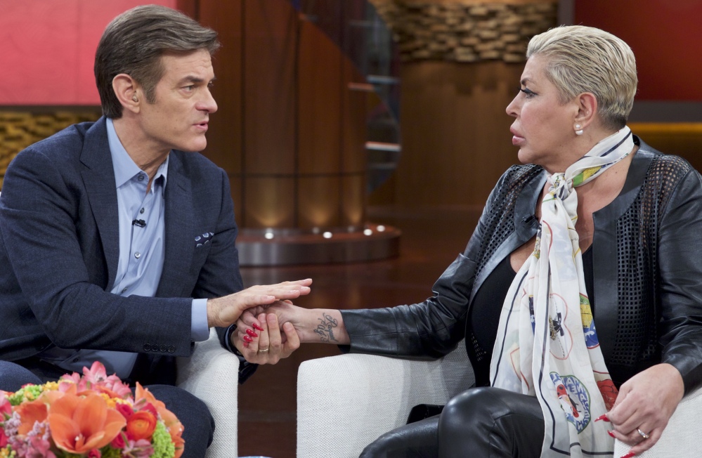 Dr. Mehmet Oz, left, talks to Angela “Big Ang” Raiola about the reality TV star’s fight with brain, throat and lung cancer and the importance of her family during a taping of Oz’s show.