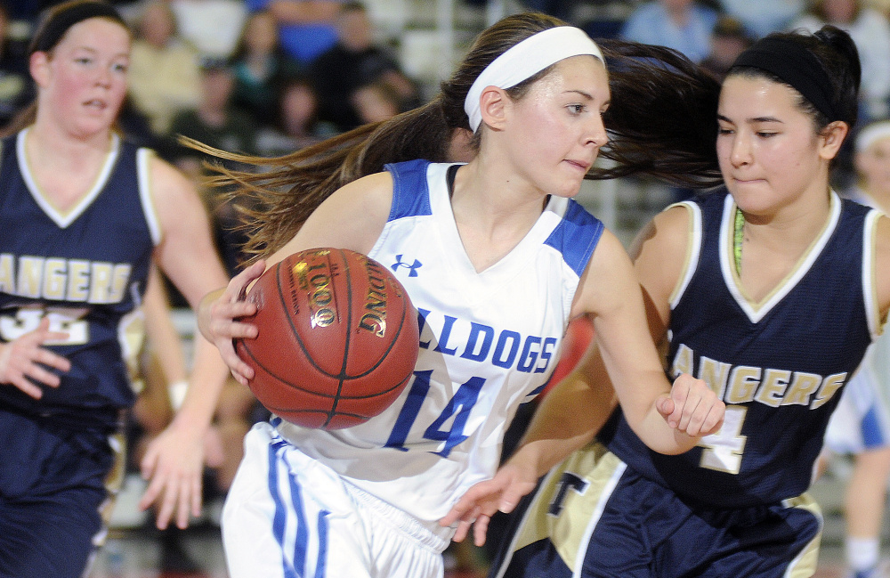 Madison’s Sydney LeBlanc drives against Kiara Perez, right, of Traip Academy during a Class C South quarterfinal Tuesday at the Augusta Civic Center. LeBlanc scored 10 points in Madison’s 43-30 win.