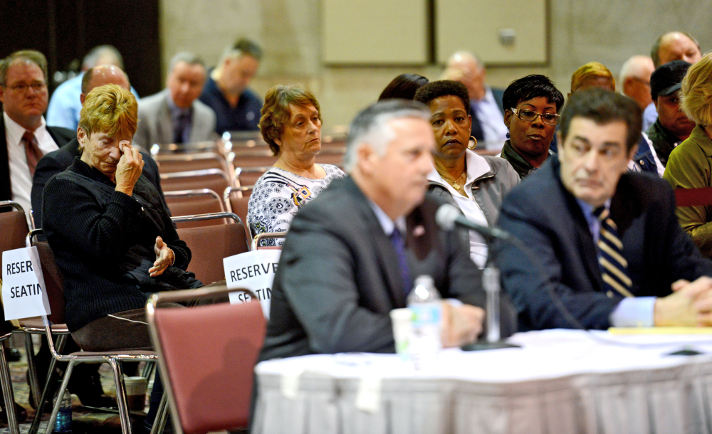 Retired Rear Admiral Philip H. Greene, Jr, President and CEO of TOTE Services, Inc., front center, sits at a hearing investigating the sinking of the El Faro ship as family members of the crew look on, in Jacksonville, Fla., Wednesday.