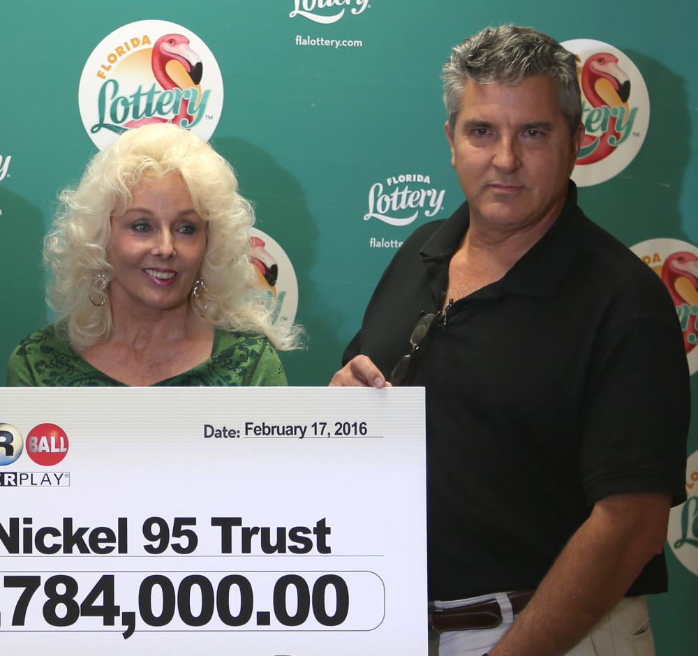 Maureen Smith and David Kaltschmidt with their one-third share of the Jan. 13, world record Powerball jackpot Wednesday, Feb. 17, 2016, in Tallahassee, Fla. John and Lisa Robertson of Munford, Tenn., cashed in their ticket last month, also taking the lump sum. The winners in California have not publicly come forward yet. (AP Photo/Steve Cannon)