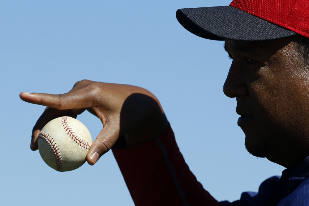 Pedro Martinez, special assistant to the Boston Red Sox general manager, gestures as he mentors pitchers during a spring-training session.