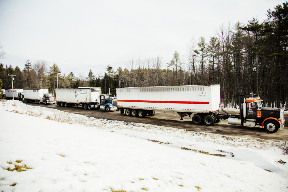 LIVERMORE FALLS, ME - JANUARY 26:  A line of semi trucks carrying wood biomass fuel outside the ReEnergy biomass plant in Livermore Falls, ME on Tuesday, January 26, 2016. Photo by Whitney Hayward/Staff Photographer)